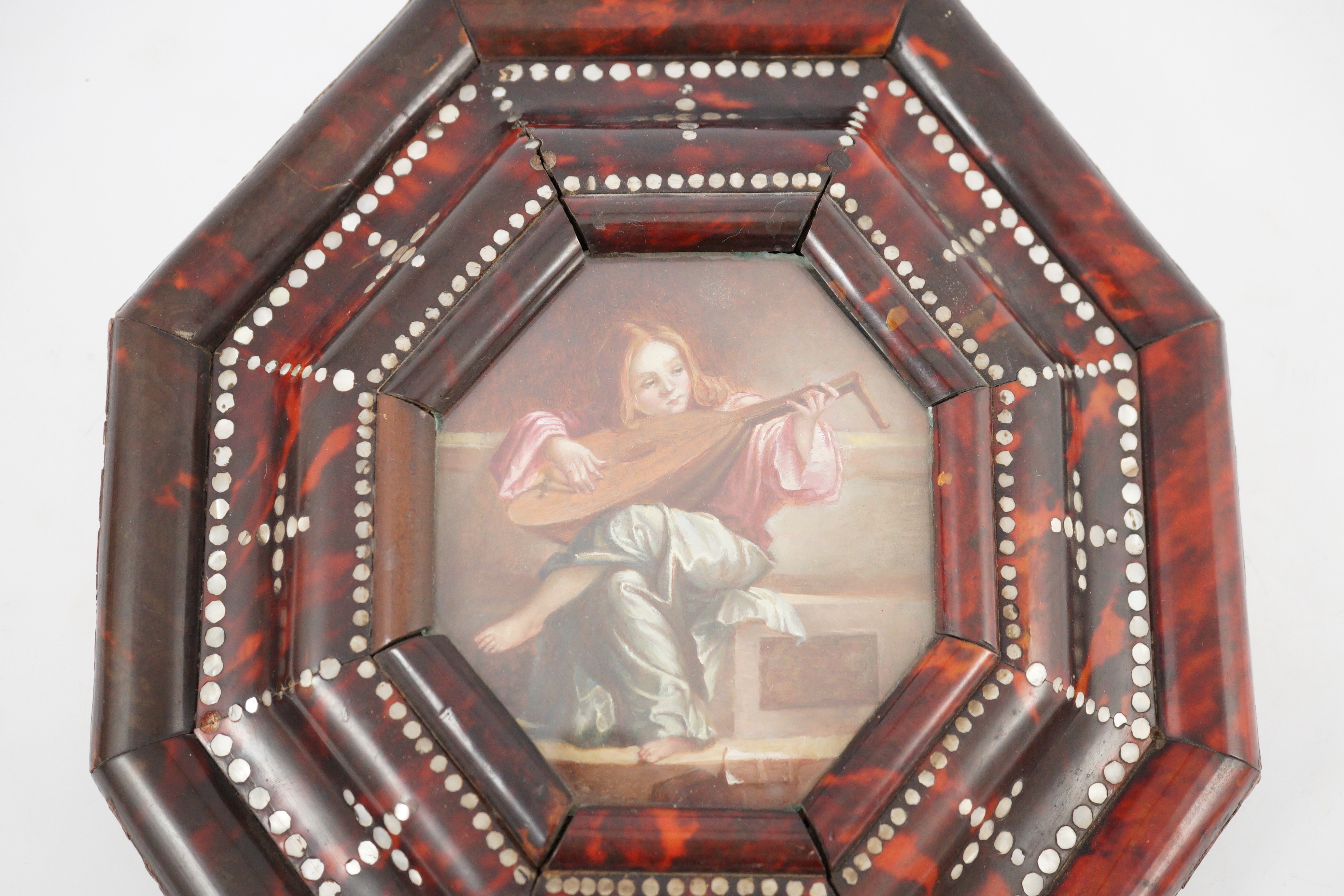 18th century Continental School, A youth playing a large lyre, oil on copper, 11.5 x 10.5cm, Indo-Portuguese mother of pearl inset tortoiseshell frame